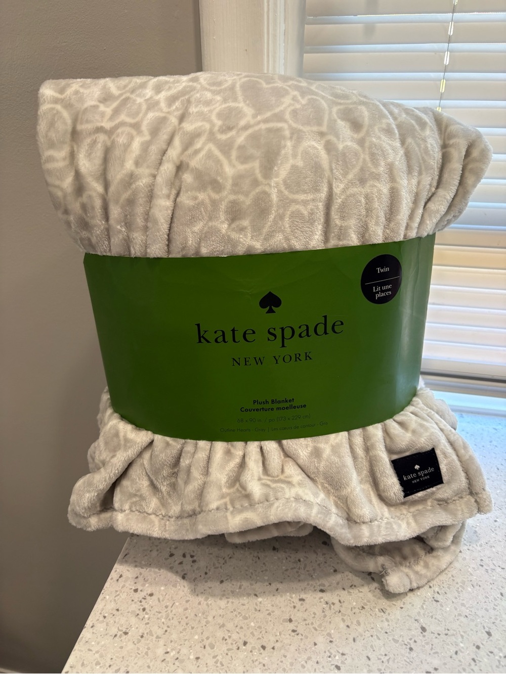 Kate Spade plush blanket gray w/ white heart outlines- “embossed heart” pattern